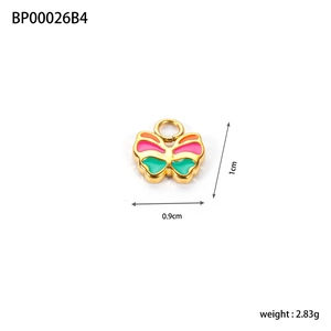 Macro detail of enamel bow charm showing 1cm height and 0.9cm width dimensions