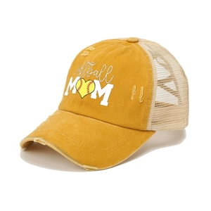 Distressed mustard yellow Softball Mom trucker hat with mesh back and ponytail cross