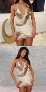Detail of V-neck halter mini dress with ruched texture and brown tie-dye fringe
