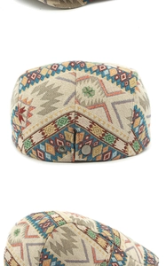 Close-up of ethnic jacquard pattern and bronze metal adjustment buckle on the beret hat