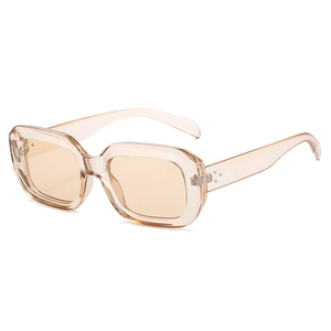 Retro square champagne transparent sunglasses with silver rivets on a white background