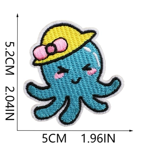 Blue cartoon octopus embroidery patch with dimensions showing 5cm width and 5.2cm height