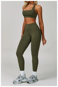 Detail of olive green high-waist yoga leggings and matching padded sports bra set