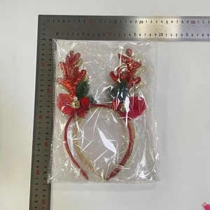 Christmas reindeer headband with glitter antlers and bells in plastic packaging with ruler