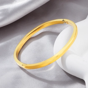 Polished gold titanium steel curved bangle bracelet with secure buckle for women