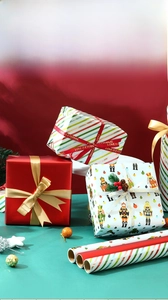 Detail of Christmas wrapping paper with nutcracker print and decorative gift ribbons
