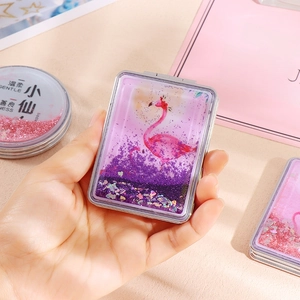 Portable folding makeup mirror with glitter quicksand shell and pink flamingo pattern