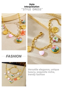 Detailed close-up of vintage enamel flower pendants and gold plated charms on jewelry set