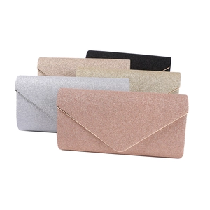 Close-up of glitter envelope evening bags in rose gold, silver, gold and black
