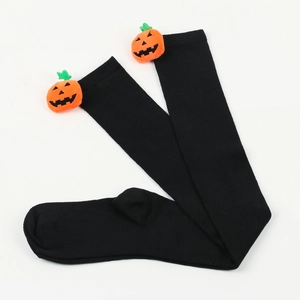 Close-up of black over-knee Halloween socks with 3D orange pumpkin doll detail