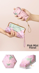 Pink floral folding umbrella with matching compact carrying case and metal clasp detail
