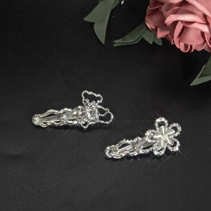 Elegant silver alloy hair clips with opal, pearls, and rhinestones on a black background