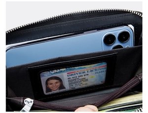 Macro view of black leather wallet interior featuring clear ID window and zipper slots