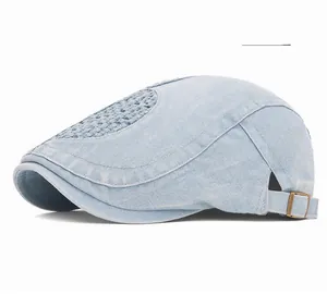 Detail of light blue washed denim ivy cap with breathable mesh and metal buckle