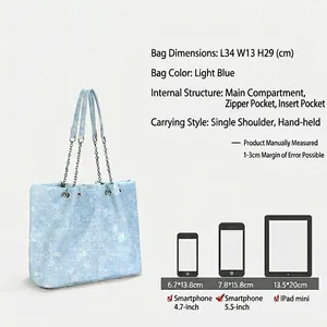 Light blue large denim tote bag with chain strap and spacious interior dimensions