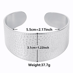 Polished silver C-shaped stainless steel cuff bracelet with a hammered texture finish