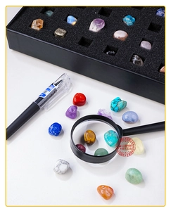 Detailed set of 43 natural mineral specimens including tiger eye and amethyst in a display box