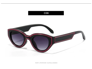 Detailansicht der ovalen Cat-Eye-Sonnenbrille mit schwarzem Rahmen und lila Akzenten