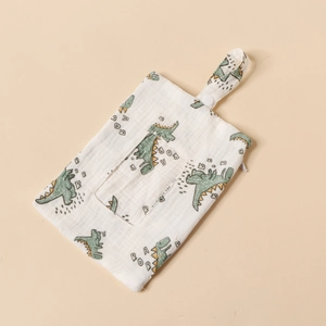 Cotton gauze crib organizer bag with zipper and green cartoon dinosaur pattern