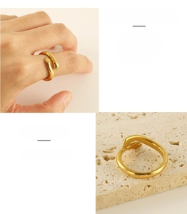 Detail of 18k gold plated stainless steel hug ring showing unique hand-shaped design