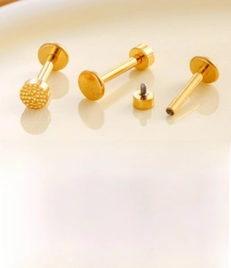Detailed macro view showing the internal thread structure and hammered titanium disc studs