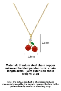 Macro shot showing dimensions of red cherry crystal pendant on a gold titanium steel chain