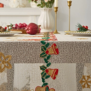 Red Christmas lace tablecloth featuring festive beadwork bells and golden snowflakes