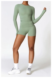 Detail of sage green long sleeve yoga top and high-waist sports shorts with high elasticity