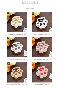 Detail showing six colorful cat claw hair clips in solid and laser gradient finishes