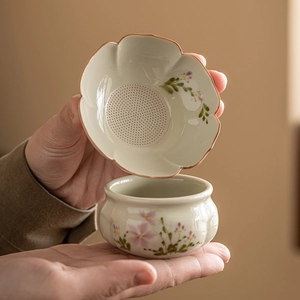 Hand-painted ceramic daisy tea strainer set with petal-shaped filter and base