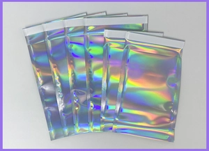 Close-up of stackable holographic mailing bags with self-adhesive seal and glossy finish