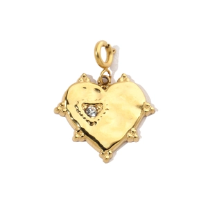 Detailed view of heart-shaped gold-plated pendant with sparkling central crystal
