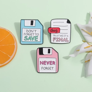 Three creative enamel floppy disk and file brooches with Don't Forget To Save text