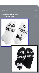 Detail of non-slip letters and game controller pattern on cotton crew socks