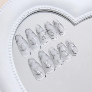 Long almond press on nails with 3d silver liquid metal lines and pearly heart mirror background