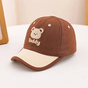Detailed view of the cute Teddy bear embroidery on this coffee and beige kids baseball cap