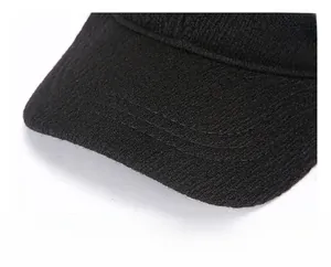 Detailed close-up of thick winter cap with fashion metal tag and precise stitching