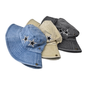 Three washed cotton bucket hats in blue, khaki, and charcoal with rhinestone star detail