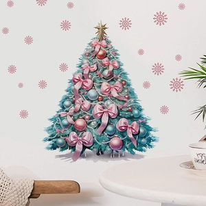 Detailed view of decorated Christmas tree wall sticker with pink bows and snowflakes