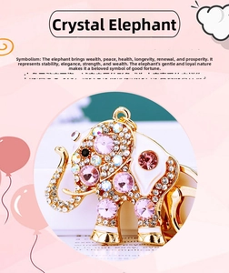 Close-up of golden elephant keychain inlaid with sparkling pink and white crystals