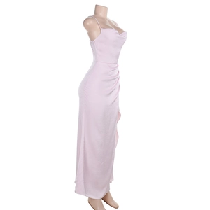 Detail of pink satin maxi dress with side ruching and elegant split hem on mannequin