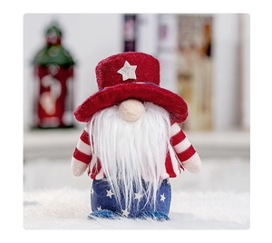 Detail of USA patriotic gnome plush with striped red and white hat and star patterns