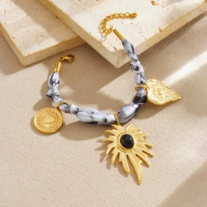 Stainless steel knot bracelet with heart palm tree pendants and grey ink print ribbon