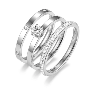 Detailed view of silver titanium steel rings set with sparkling cubic zirconia stones