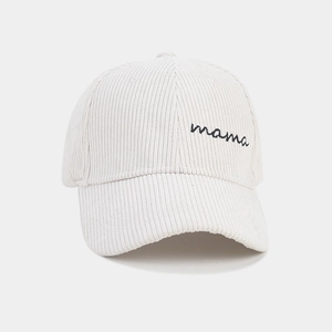 Close-up of cream corduroy baseball cap featuring black 'mama' script embroidery