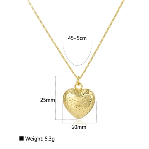 Detail view of 18k gold hollow heart pendant with textured surface and size markings