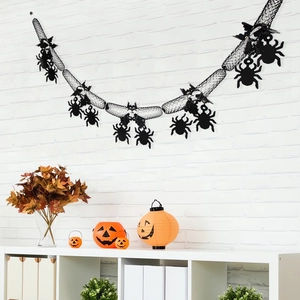 Spider silhouettes on black mesh garland for Halloween party wall decoration backdrop