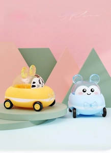 Close-up of cute cartoon tiger and bear toy cars with transparent cockpits in gift set
