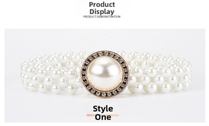 Detailed close-up of triple-row pearl waist belt with a sparkling rhinestone buckle decoration