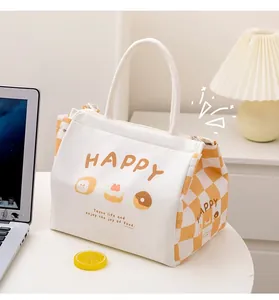 Detail of canvas lunch bag with orange HAPPY text and checkered pattern in office setting